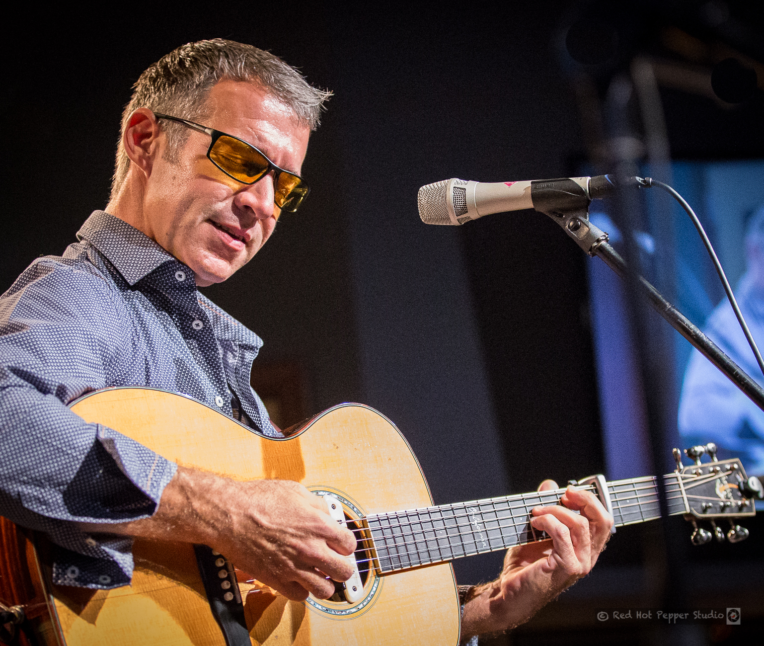Sam Pacetti performing live with his acoustic guitar
