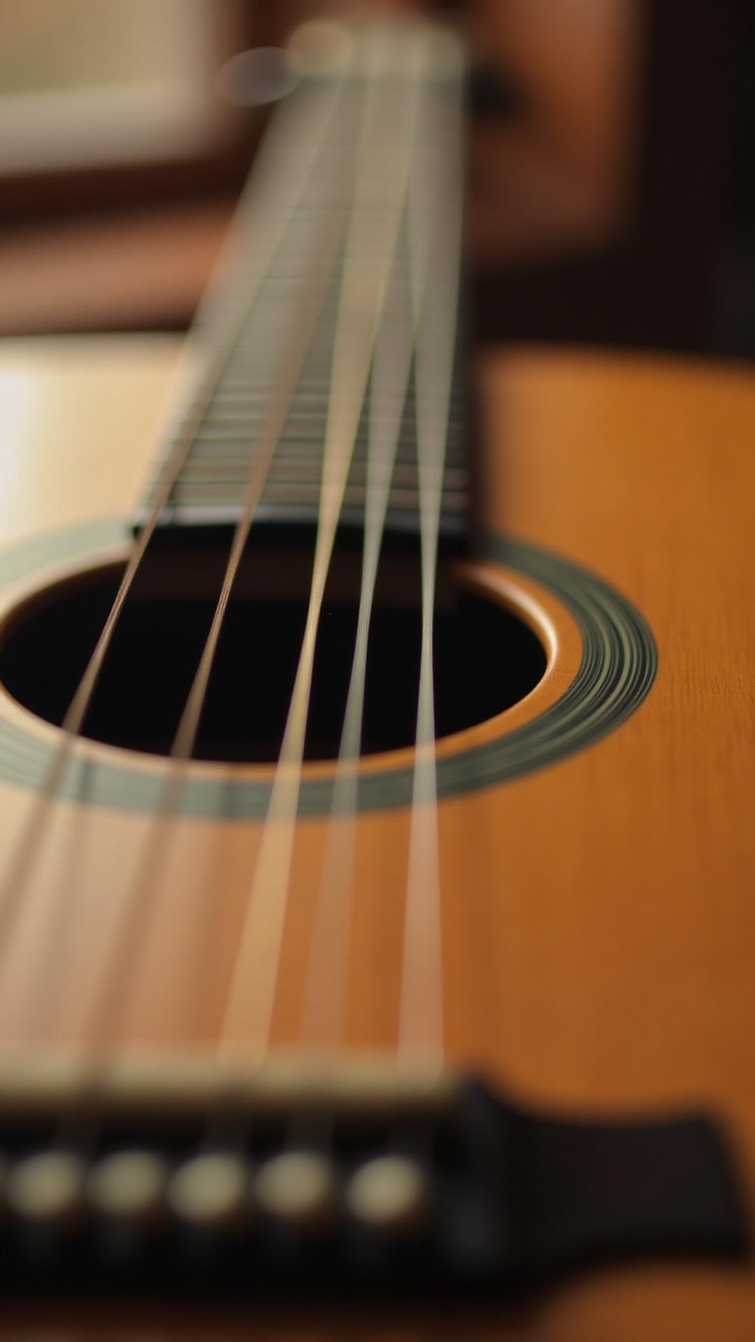 Close detail of Sam Pacetti's acoustic guitar